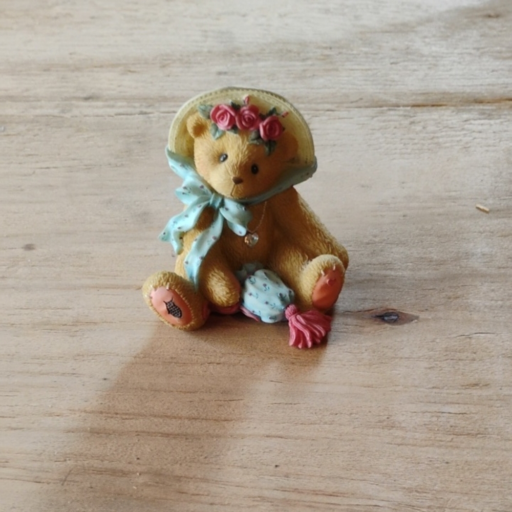 Adorable Teddy Bear Figurine with Floral Hat